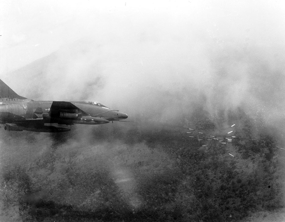In May 1967, Air Force F-100 Super Sabre fires salvo of rockets at jungle target in South Vietnam (U.S. Air Force)