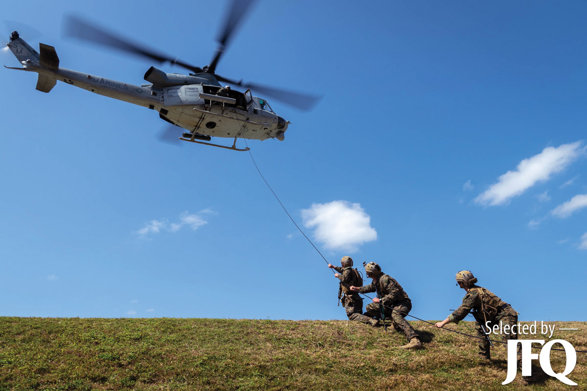 U.S. Marines load simulated casualty onto UH-1Y Venom during casualty evacuation training