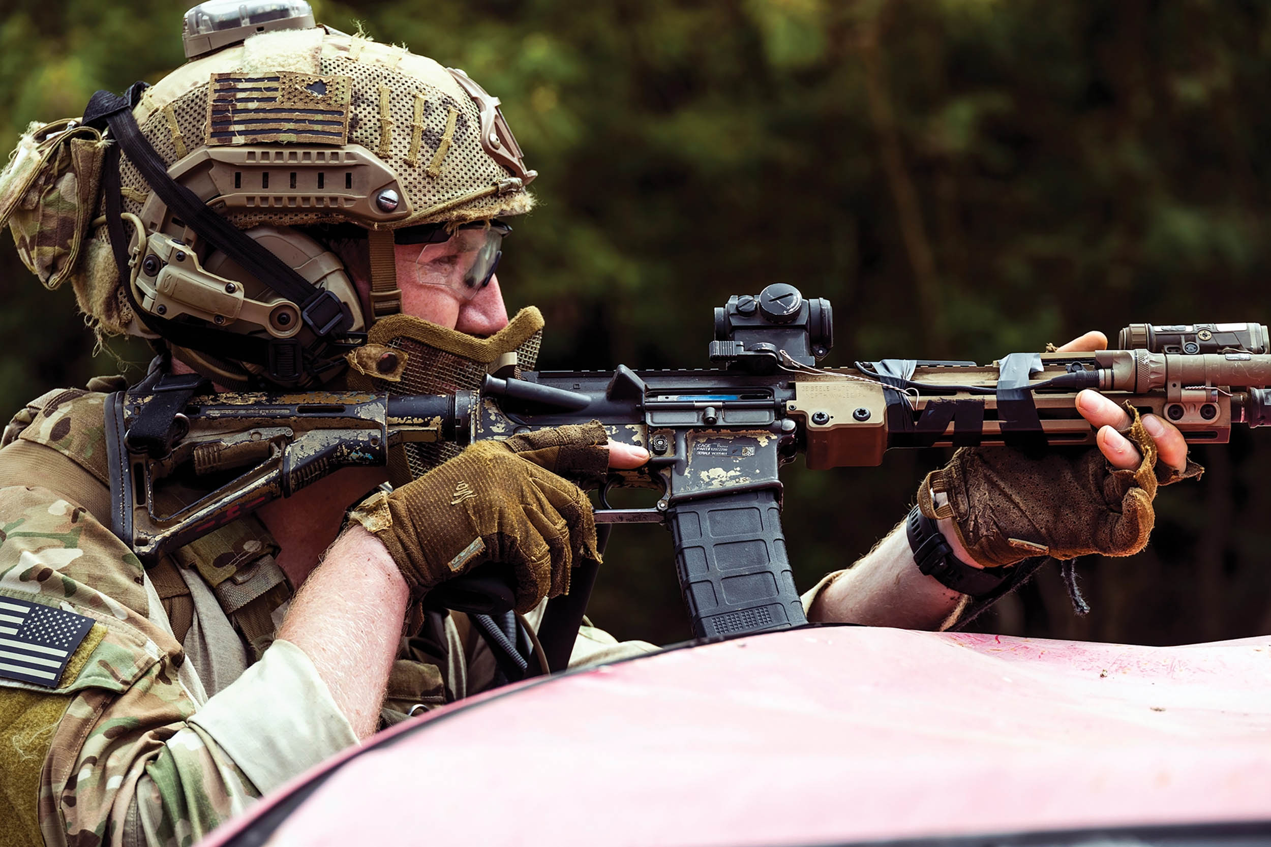 Army Ranger aims rifle during Military Operations in Urban Terrain training