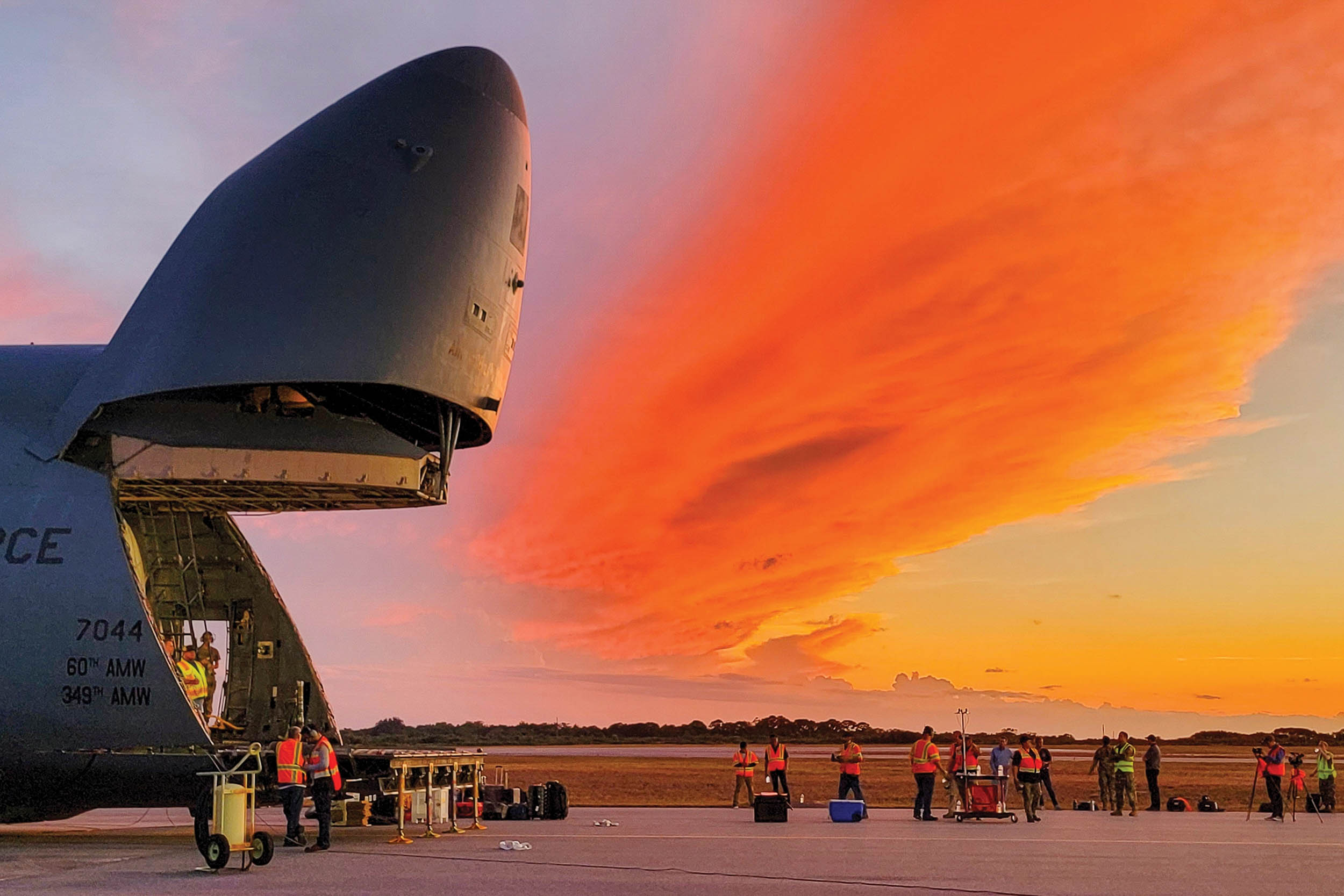 Loadmasters from 60th Air Mobility Wing and Lockheed Martin Space unload sixth Geosynchronous Earth Orbit Space Based Infrared System satellite from C-5M Super Galaxy, at Cape Canaveral Space Force Station, Florida, June 2, 2022 (U.S. Space Force/Walter Talens)