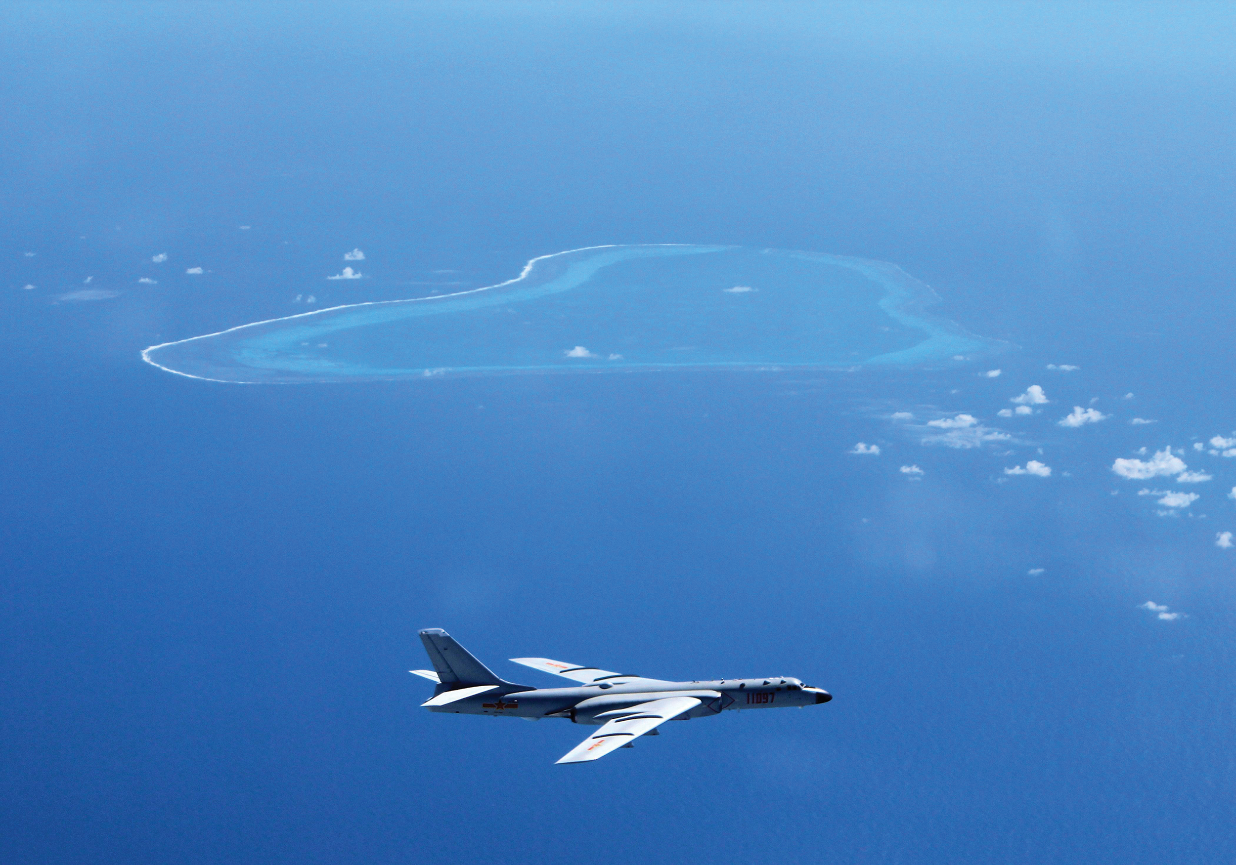 People’s Liberation Army Air Force sends Chinese bombers and other aircraft to patrol islands and reefs in South China Sea