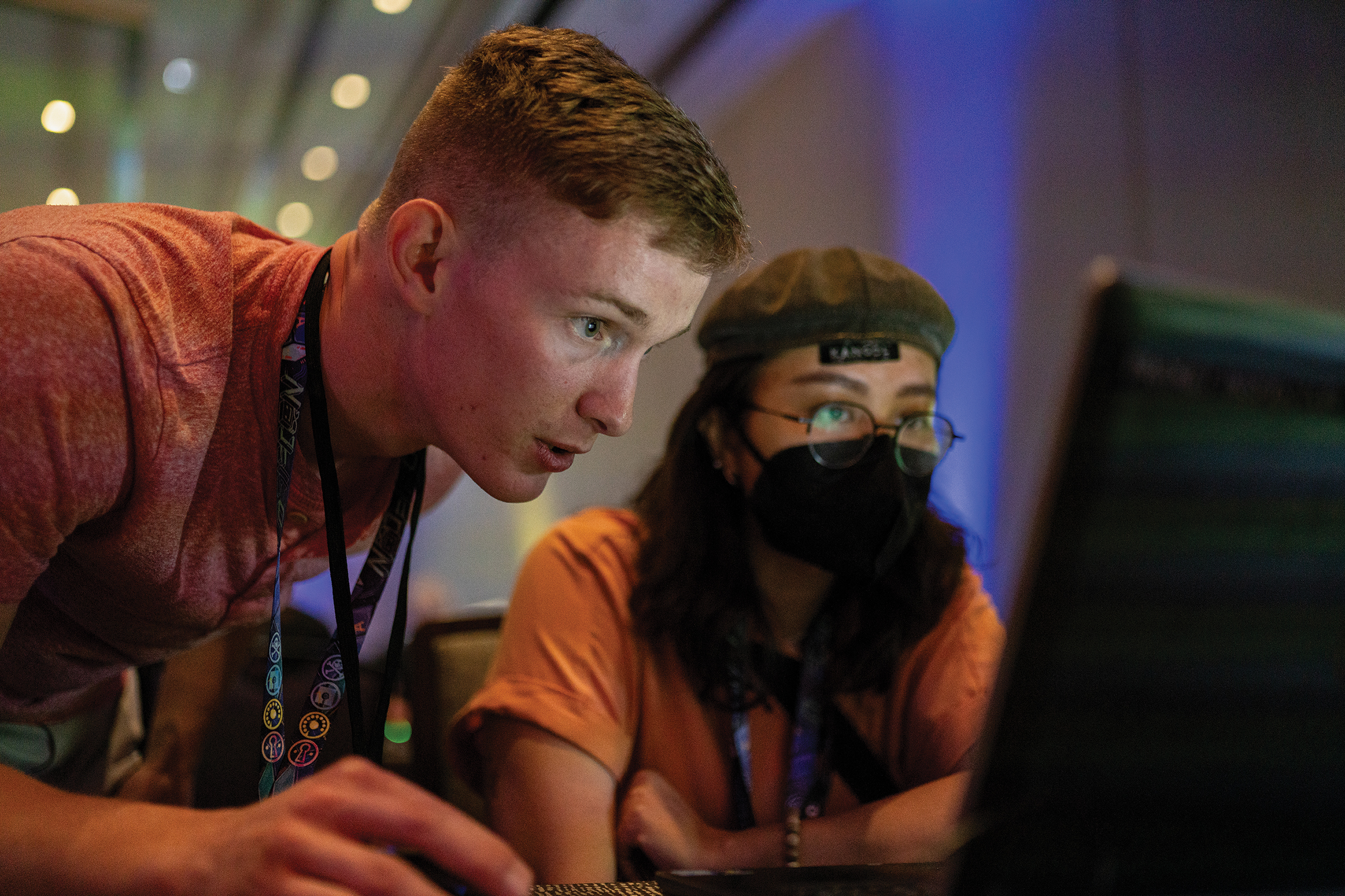 Marine Corps Corporal helps civilian with computer network analysis hacking game called Packet Inspector at DEF CON 31, Las Vegas, Nevada