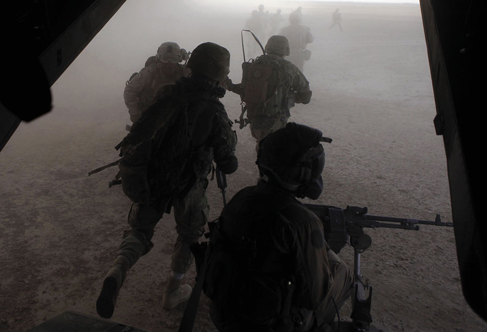 U.S. Marines and Georgian soldiers exit USMC MV-22 Osprey tiltrotor aircraft during operation in Helmand Province (DOD/Ashley E. Santy)