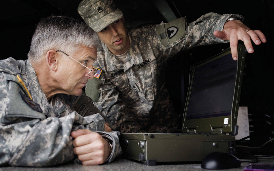 Army Staff Sergeant briefs Army Chief of Staff, General George W. Casey, Jr., about new technologies used in war against terrorism (U.S. Army/D. Myles Cullen)
