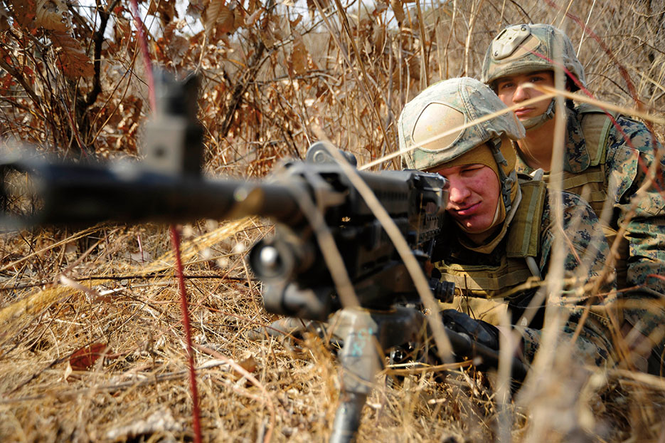 Marines select targets in tactical movement training at Camp Rodriguez, South Korea (DOD/James Norman)