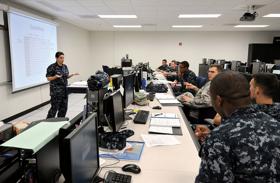 Students answer questions during Joint Cyber Analysis Course at Center for Information Dominance (U.S. Navy/Jessica Gaukel)