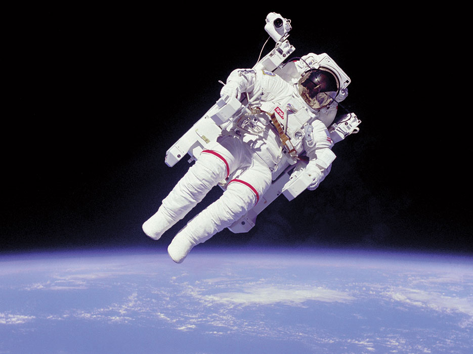 Astronaut conducts space walk