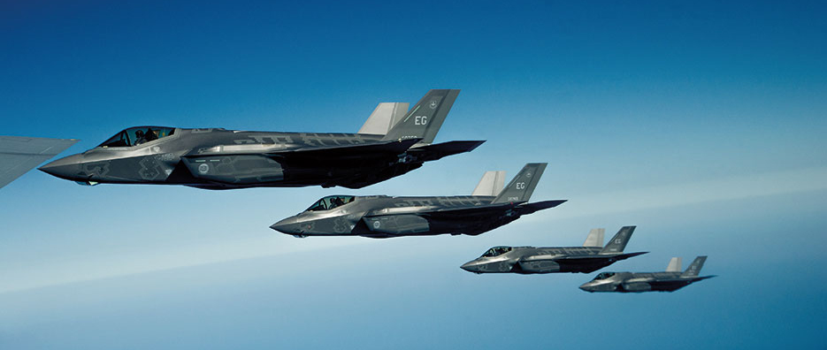 U.S. Air Force F-35A Lightning II Joint Strike Fighters fly in formation off right wing of KC-135R Stratotanker following aerial refueling mission along Florida coast (U.S. Air Force/John R. Nimmo, Sr.)