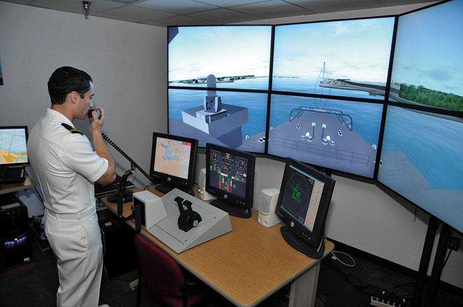 Sailor assigned to amphibious transport dock ship USS Ponce uses voice-recognition system to command virtual simulation of Ponce in Conning Officer Virtual Environment (U.S. Navy/Nathanael Miller)