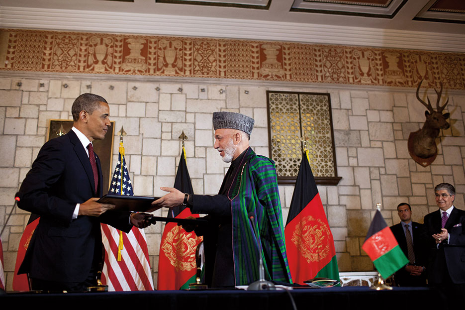 President Obama and Afghan President Hamid Karzai exchange documents at Presidential Palace in Kabul after signing Enduring Strategic Partnership Agreement (White House/Pete Souza)