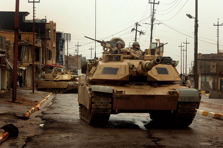 M1 Abrams tanks maneuver in streets of Tall Afar, Iraq, as they conduct combat patrol (U.S. Air Force/Aaron Allmon)
