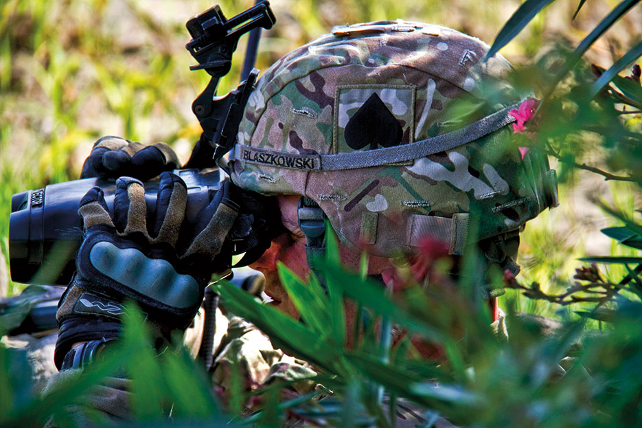 Soldier scans surrounding area for potential enemy movement during mission in Saberi district of Khowst Province, Afghanistan (U.S. Army/Justin A. Moeller)