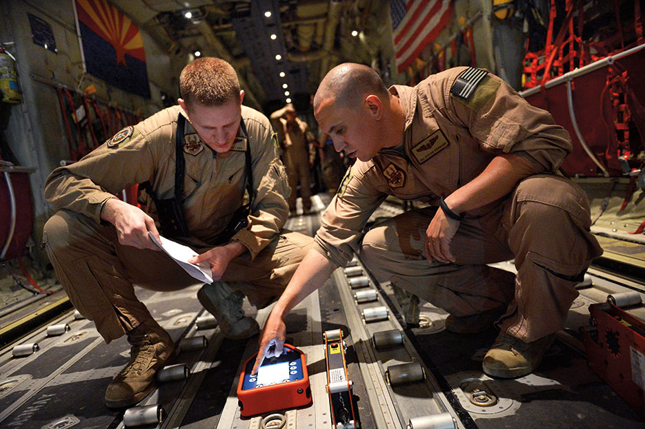 Senior Airmen program Wireless Gate Release System before airdrop at Bagram Air Field (U.S. Air Force/Evelyn Chavez)
