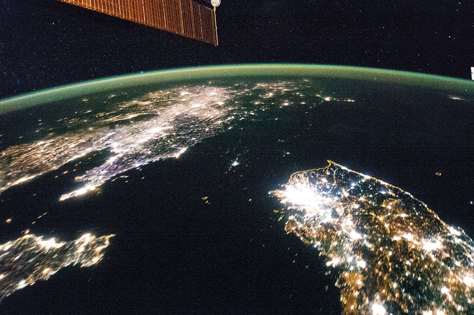 Flying over East Asia, Expedition 38 crewmember on International Space Station took this night image of the Korean Peninsula (NASA)