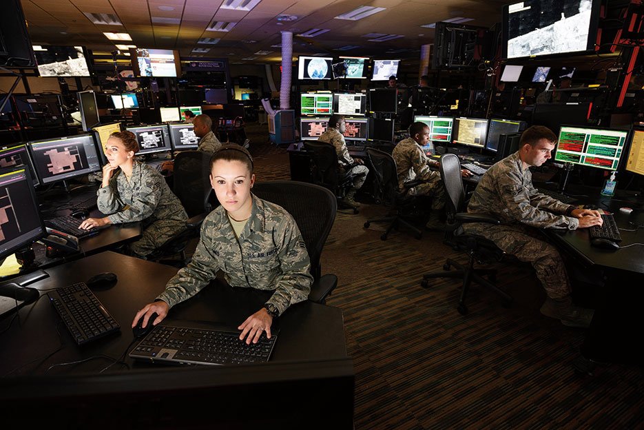 Airmen working on Distributed Ground Station–1 Operations Floor at the U.S. Air Force’s 480th Intelligence, Surveillance, and Reconnaissance Wing (U.S. Air Force)