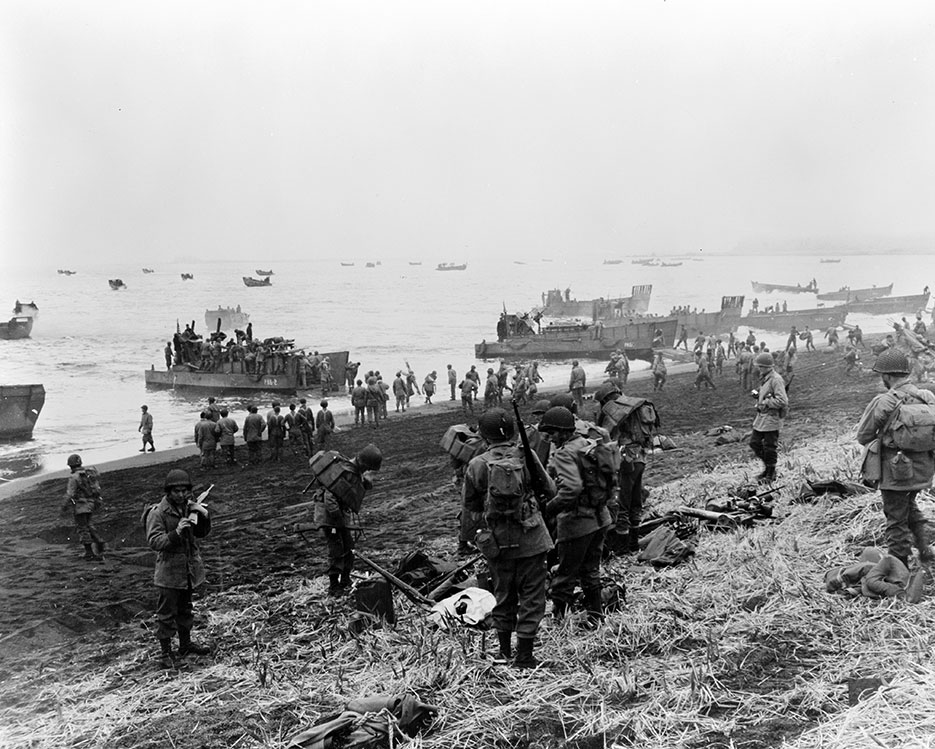 Landing boats pouring southern landing force Soldiers and their equipment onto beach at Massacre Bay, Attu, Aleutian Islands (Library of Congress, Prints & Photographs Division, FSA/OWI Collection)