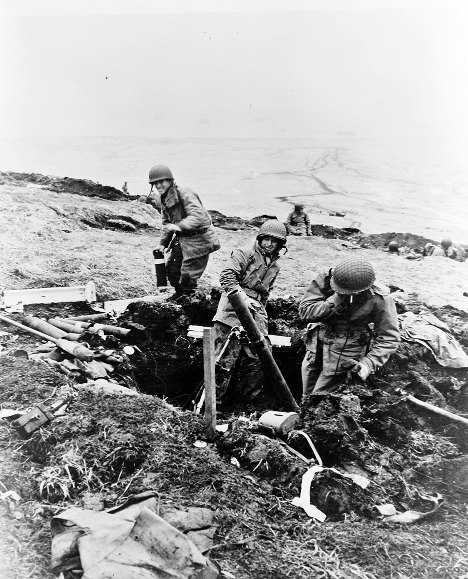 Soldiers hurling trench mortar shells over ridge into Japanese positions, Attu, Aleutian Islands (Library of Congress, Prints & Photographs Division, FSA/OWI Collection)