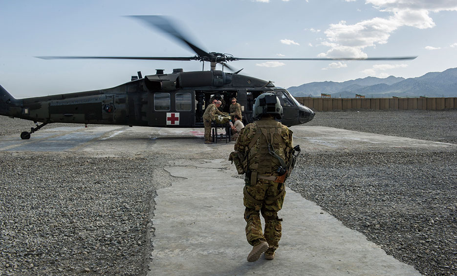 Servicemember trained as tactical critical care evacuation team nurse prepares for patient transfer mission at Forward Operating Base Orgun East, Afghanistan (U.S. Air Force/Marleah Miller)