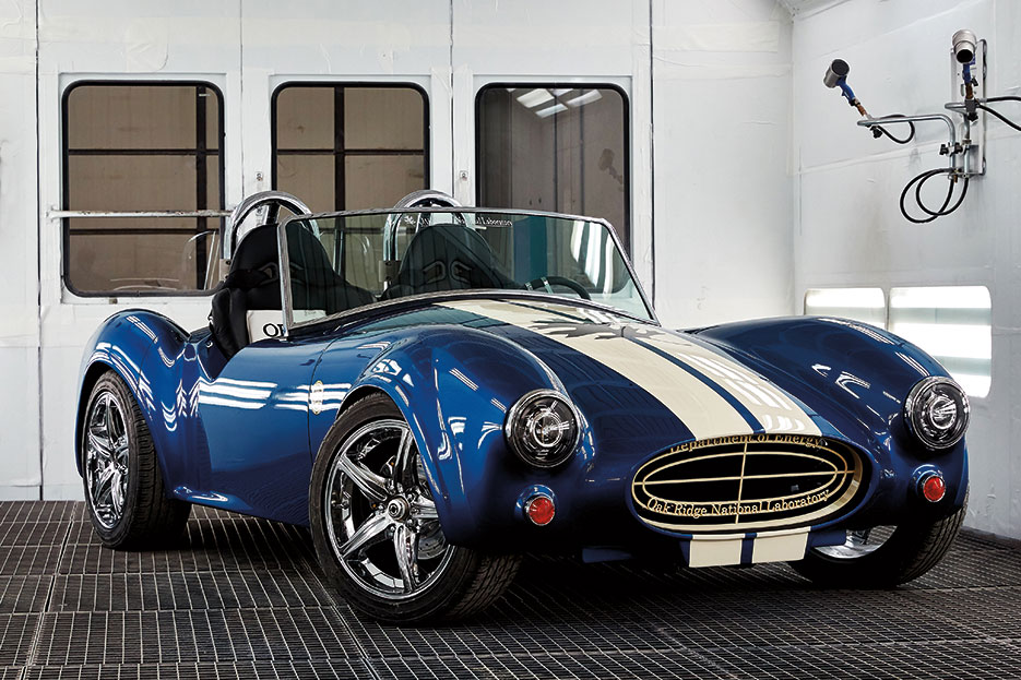 Shelby Cobra—approximately 1,400-pound vehicle containing 500 pounds of printed parts made of 20 percent carbon fiber—produced by Big Area Additive Manufacturing Machine, which manufactures strong, lightweight composite parts in sizes greater than 1 cubic meter (DOE)