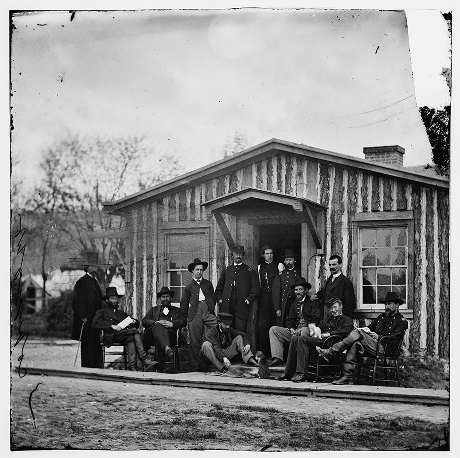 Members of Grant’s staff during main eastern theater of war, siege of Petersburg, Virginia, June 1864–April 1865, with photographer Mathew Brady standing at far left (LOC)