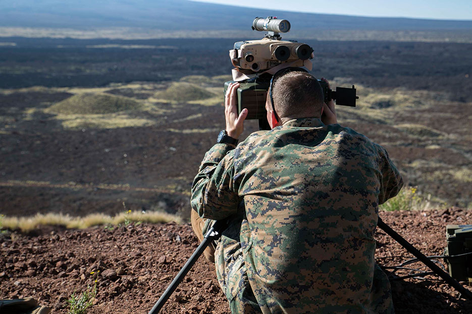 Joint terminal attack controller sights target with AN/PED-1 Lightweight Laser Designator Rangefinder to mark simulated hostile threats for air assets (U.S. Marine Corps/Devon Tindle)