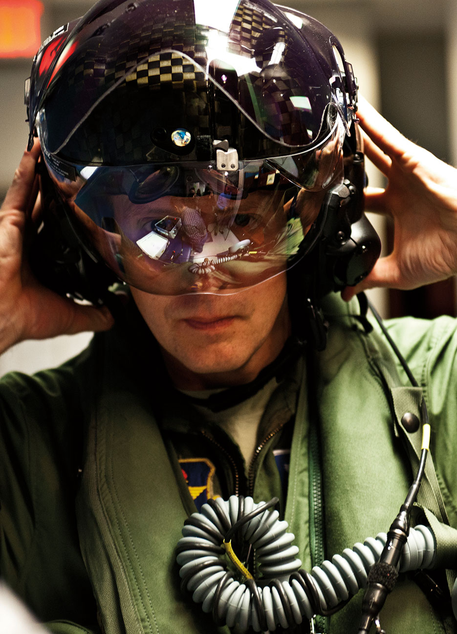 First Air Force pilot qualified to fly F-35 secures helmet prior to stepping to F-35A Lightning II joint strike fighter at Eglin Air Force Base (U.S. Air Force/Samuel King)