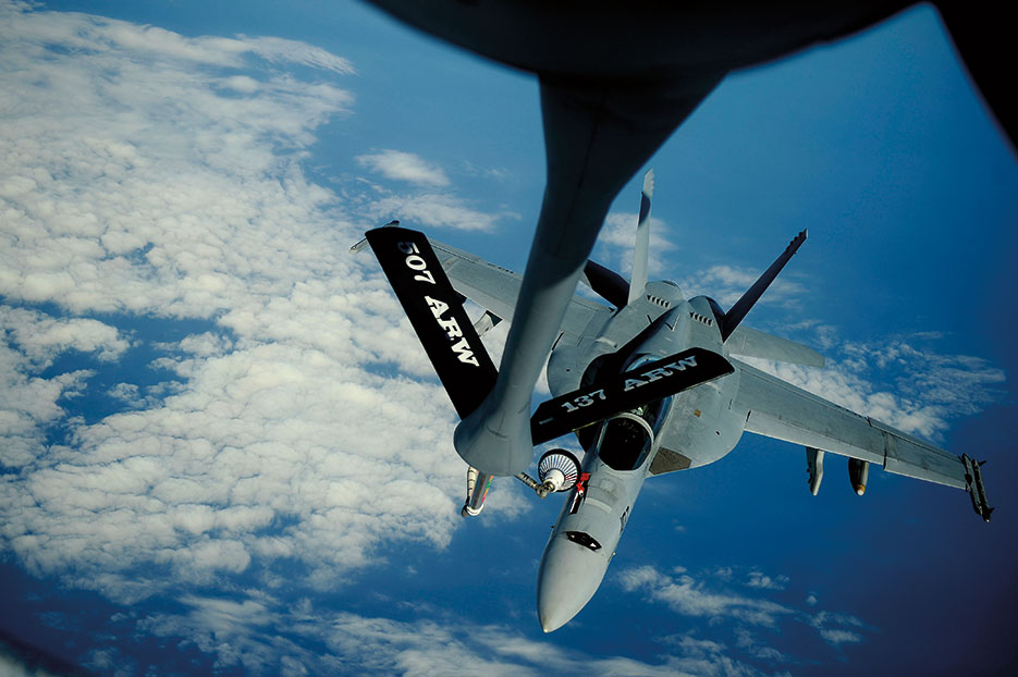 KC-135 Stratotanker assigned to 465<sup>th</sup> Air Refueling Squadron, 507th Air Refueling Wing, delivers fuel to F/A-18F Super Hornet assigned to Black Knights of Strike Fighter Squadron 154 supporting Rim of the Pacific 2010 exercises (U.S. Air Force/Kamaile O. Long)