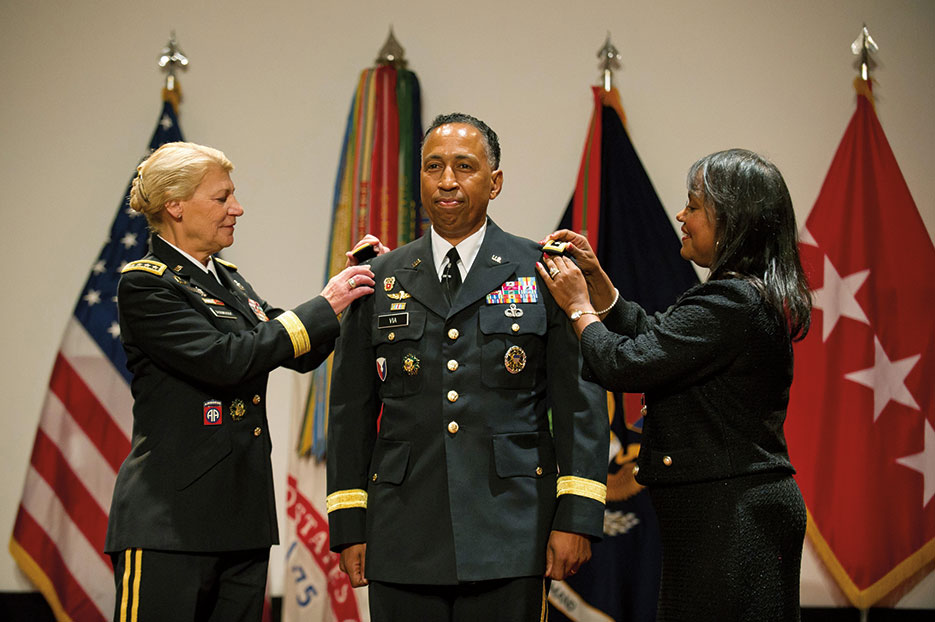 GEN Ann Dunwoody, Commanding General of Army Materiel Command, and Mrs. Linda Via promote LTG Dennis Via to rank of general during ceremony at Redstone Arsenal, Alabama, August 2012 (U.S. Army/Teddy Wade)