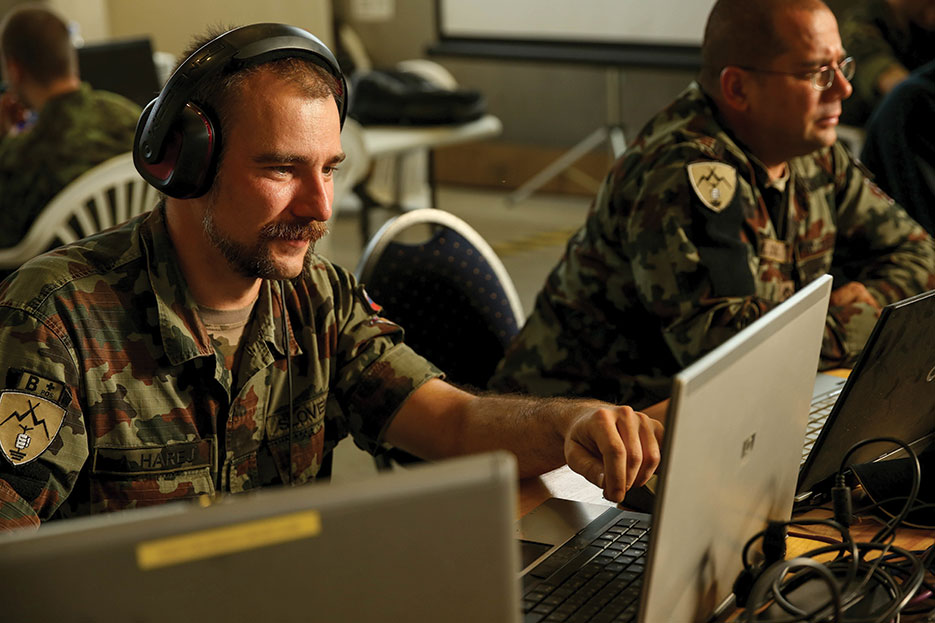 Slovenian soldier assesses mission group’s response to cyber attack during Combined Endeavor 14, world’s largest C4 systems exercise (U.S. Marine Corps Forces Europe/Derrick K. Irions)