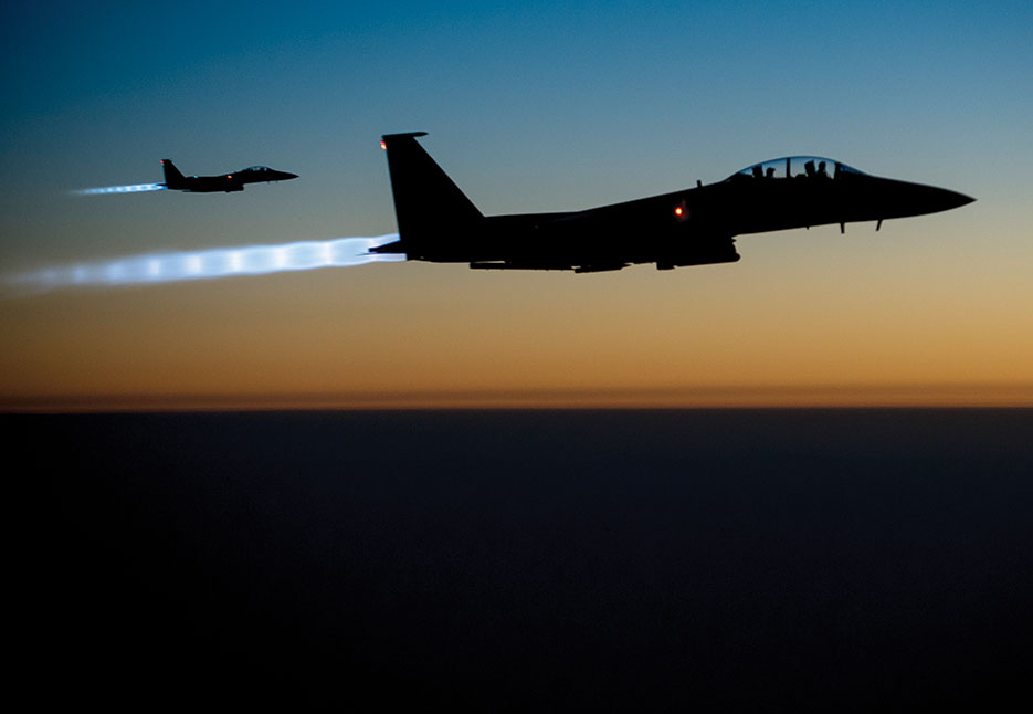 Two U.S. Air Force F-15E Strike Eagle aircraft fly over northern Iraq after conducting airstrikes against ISIL targets in Syria (DOD/Matthew Bruch)