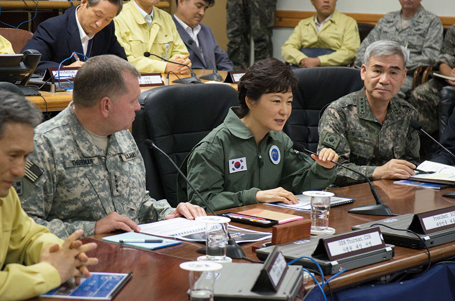 General James D. Thurman, United Nations Command, Combined Forces Command and United States Forces Korea commander, and General Kwon Oh Sung, Combined Forces Command deputy commander, brief Republic of Korea President Park Geun-hye on status of Ulchi Freedom Guardian exercise, August 22, 2013 (U.S. Army/Brian Gibbons)