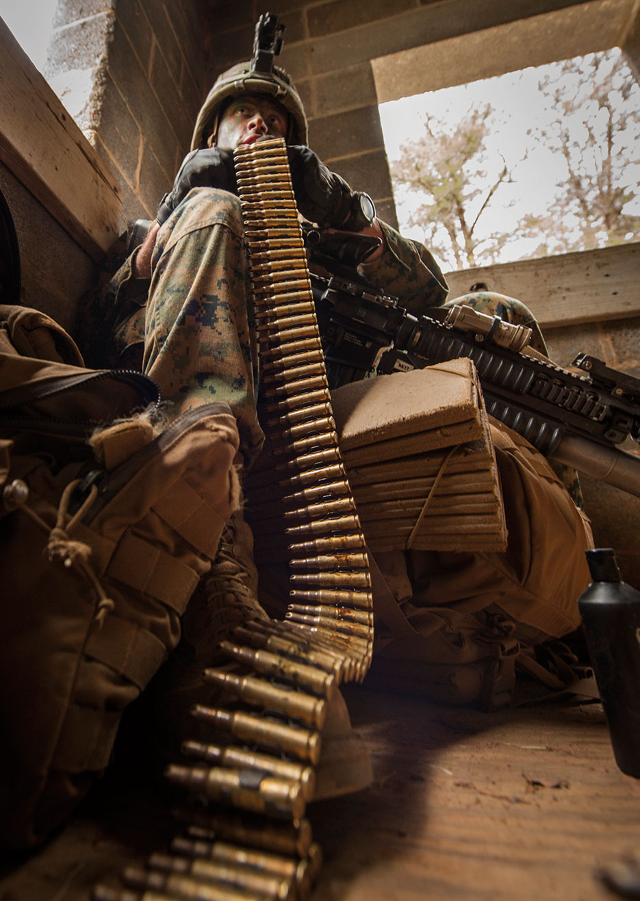 U.S. Marine Corps officer assigned to Company A, The Basic School, prepares his ammunition during “The War” field training exercise aboard Marine Corps Base Quantico, April 16, 2015 (U.S. Marine Corps/Ezekiel R. Kitandwe)