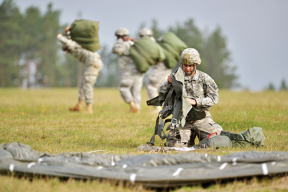 U.S. Paratroopers assigned to 91st Cavalry Regiment, 173rd Airborne Brigade, recover parachutes following jump during airborne exercise with German and Czech counterparts at 7th Army Joint Multinational Training Command’s Grafenwoehr Training Area, Germany, October 1, 2014 (U.S. Army/Gertrud Zach)