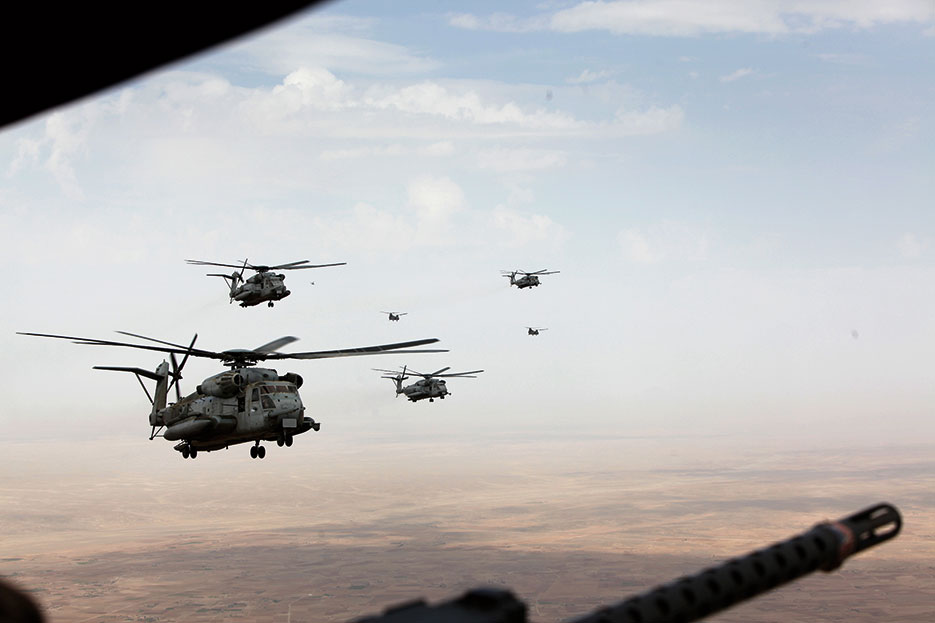 Marine Corps and Royal Air Force helicopters fly in formation after departing Camp Bastion, Afghanistan, October 27, 2014 (U.S. Marine Corps/John Jackson)