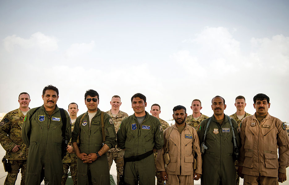 Afghan air force aircrew and NATO Air Training Command–Afghanistan air advisors stand together after first-ever all-Afghan C-130 flight, Kabul, Afghanistan, June 16, 2014 (U.S. Air Force/Vernon Young, Jr.)
