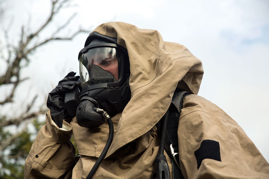 CBRN defense specialist Marine radios team during joint-training exercise between III Marine Expeditionary Forces CBRNE Ordnance Disposal units at Central Training Area, Camp Hansen, Okinawa, January 2016 (U.S. Marine Corps/Kelsey M. Dornfeld)