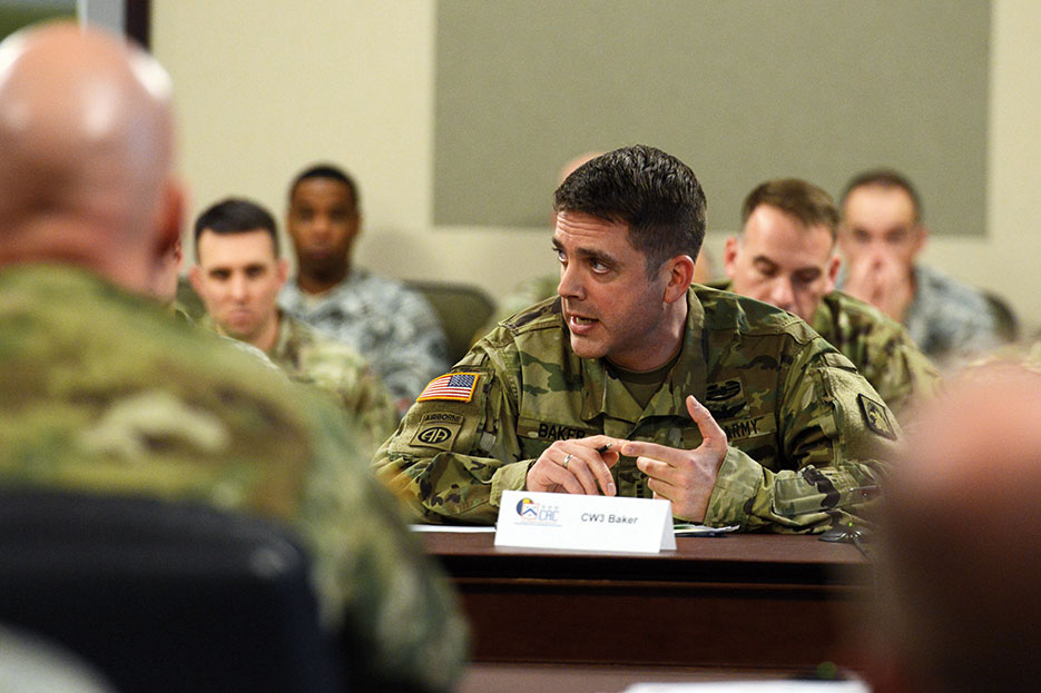 U.S. Army Warrant Officer presents team findings during Warrant Officer Solarium at Command and General Staff College, Fort Leavenworth, Kansas, January 2016 (DOD/David Vergun)
