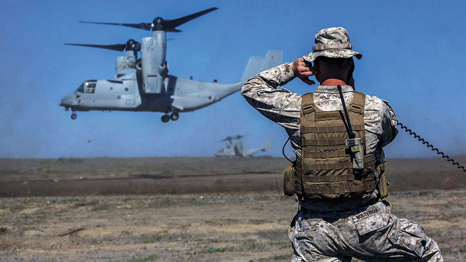 Marine assigned to 13<sup>th</sup> Marine Expeditionary Unit coordinates landing of MV-22 Osprey on San Clemente Island, California, September 2015 (U.S. Marine Corps/Alvin Pujols)