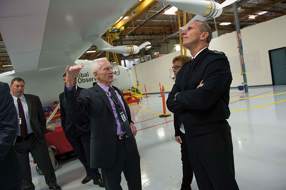 Chairman and CEO of AeroVironment briefs Chief of Naval Operations Admiral Jonathan Greenert on capabilities and potential applications of Global Observer, a long-range, long-duration UAV, Simi Valley, California, November 2014 (U.S. Navy/Peter D. Lawlor)