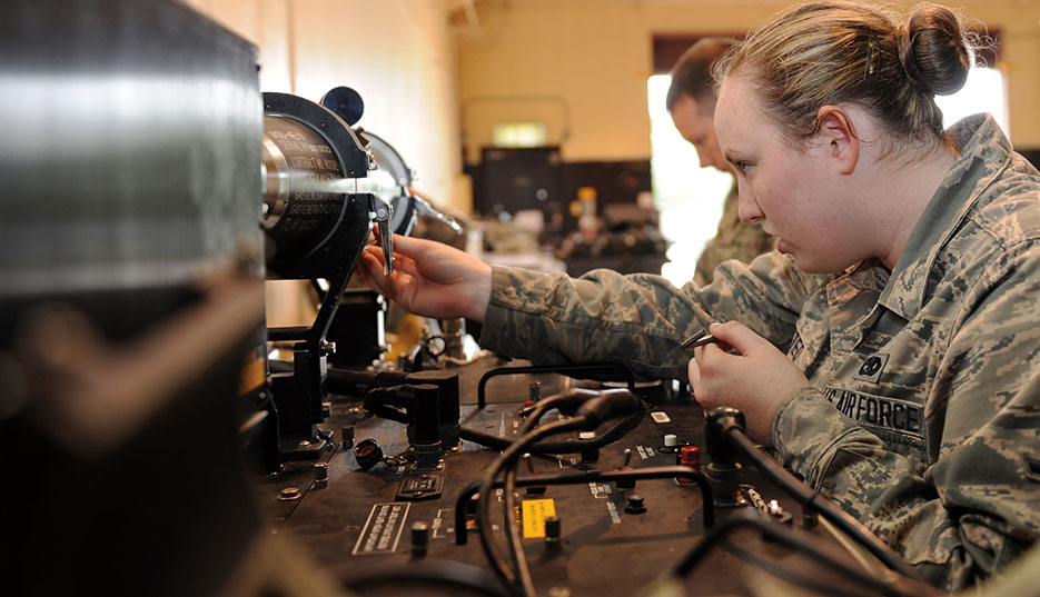 Airman connects AIM-9 Sidewinder to guidance control section unit test set at Misawa Air Base, Japan, July 2013 (U.S. Air Force/Kia Atkins)