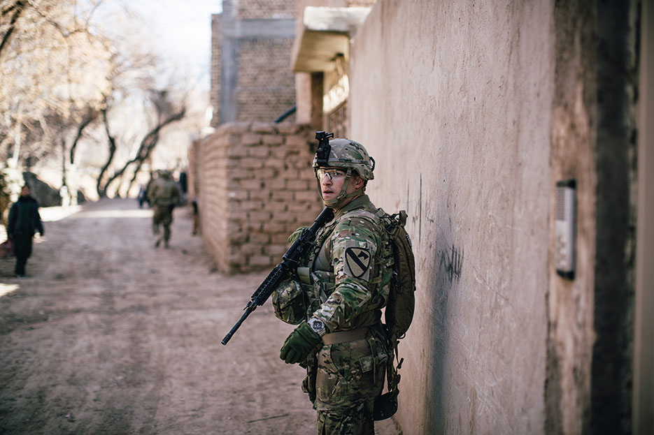 Soldier assigned to Delta Company, 1<sup>st</sup> Squadron, 8<sup>th</sup> Cavalry Regiment, 2<sup>nd</sup> Brigade Combat Team, 1<sup>st</sup> Cavalry Division, conducts presence patrol around U.S. Consulate in Herat, Afghanistan, January 2014 (U.S. Army/Alex Flynn)