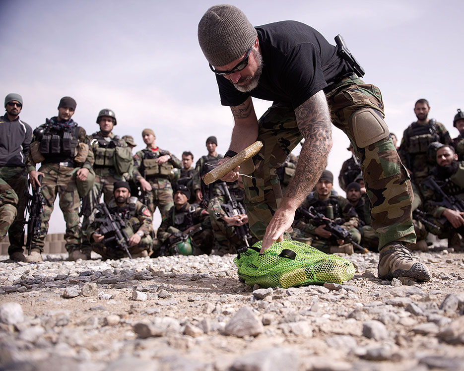 Joint Expeditionary Team advisor teaches Afghan National Army commandos about improvised explosive devices at Camp McCloskey, Afghanistan (DOD)