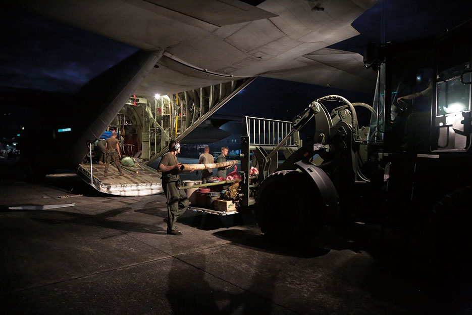 Marines with Marine Aerial Refueler Transport Squadron 352 offload KC-130J Super Hercules at Clark Air Force Base, Philippines, during Operation Damayan, November 22, 2013 (U.S. Marine Corps/Caleb Hoover)