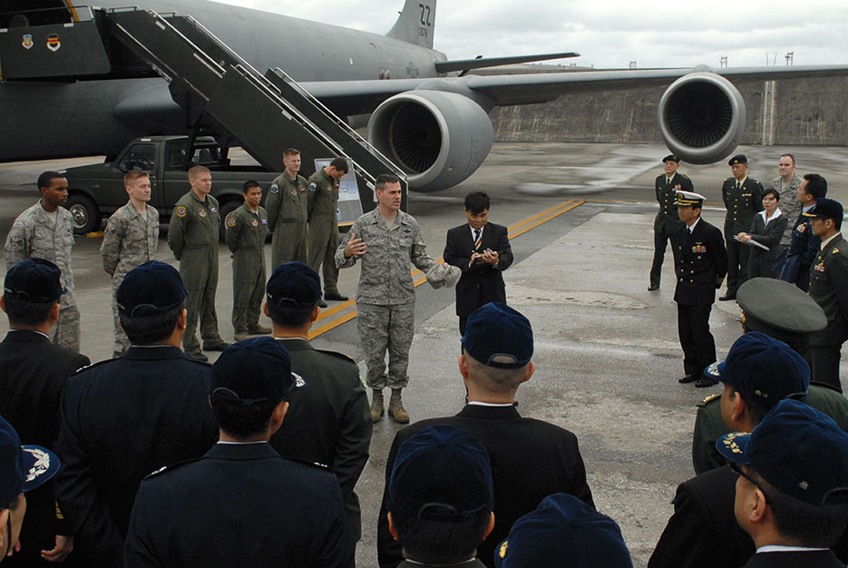 Colonel Lenny Richoux, 18th Wing vice commander, addresses group of students and instructors from Japan Self Defense Force Joint Staff College at Kadena Air Base as part of Japan’s year-long advanced professional military education program, February 3, 2010 (U.S. Air Force/Christopher Hummel)