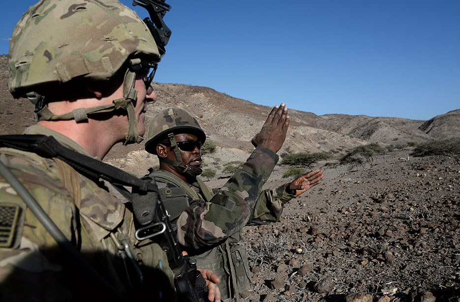 French soldier discusses objectives with U.S. Soldier during field training exercise in Arta, Djibouti, March 16, 2016 (U.S. Air Force/Kate Thornton)