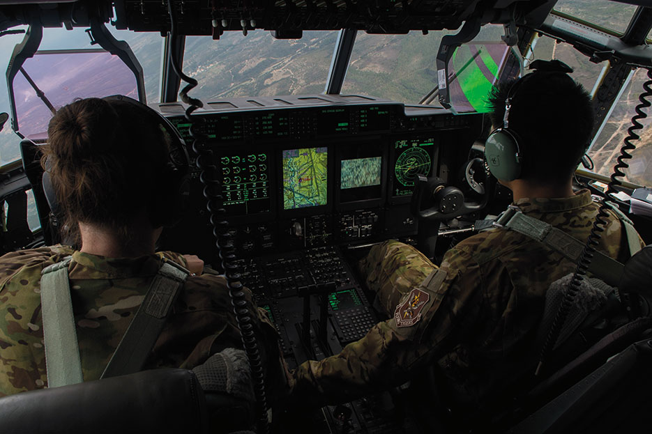 Two pilots assigned to 71st Rescue Squadron at Moody Air Force Base, Georgia, fly C-130J Hercules during rescue and refueling training near Beja Air Base, Portugal, October 23, 2015, in support of Trident Juncture 2015 (U.S. Air Force/Luke Kitterman)
