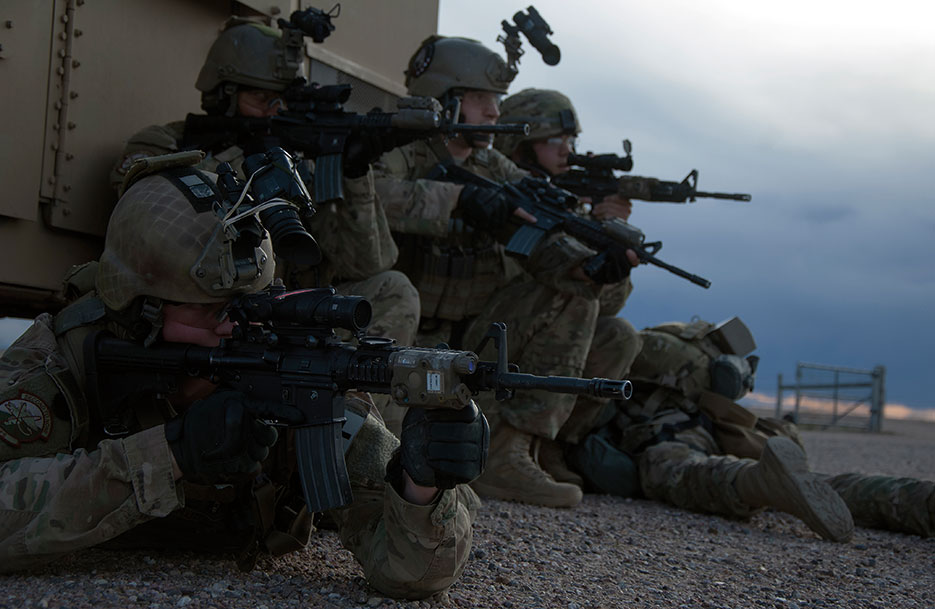 Defenders from 790th Missile Security Forces Squadron Tactical Response Force take up defensive positions, April 14, 2016, as they prepare to advance toward launch facility during exercise in F.E. Warren Air Force Base, Wyoming, Missile Complex (U.S. Air Force/Brandon Valle)