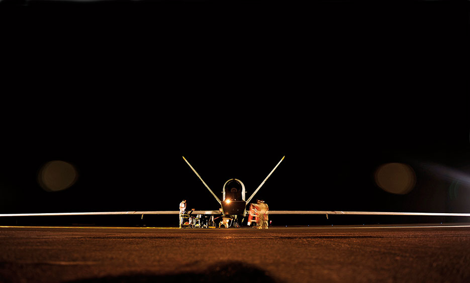 U.S. Air Force RQ-4 Global Hawk aircraft maintenance technicians perform preflight checks prior to mission, November 2010 (U.S. Air Force/Andy M. Kin)