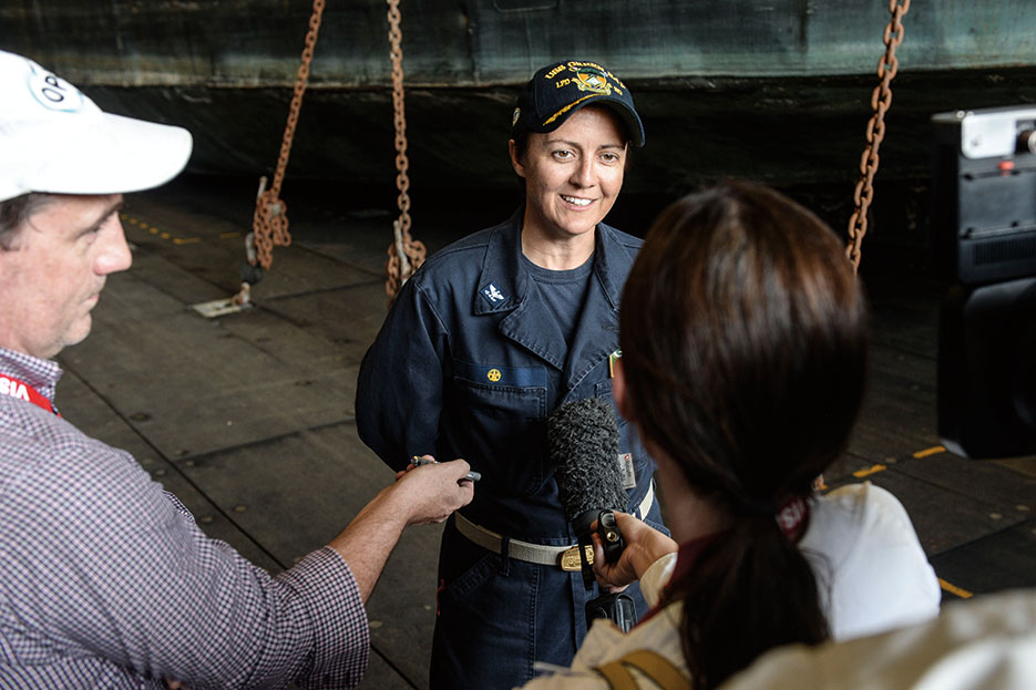 Captain of amphibious transport dock ship USS Green Bay speaks with Australian journalists while participating in Talisman Sabre 2015 (U.S. Navy/Derek A. Harkins)