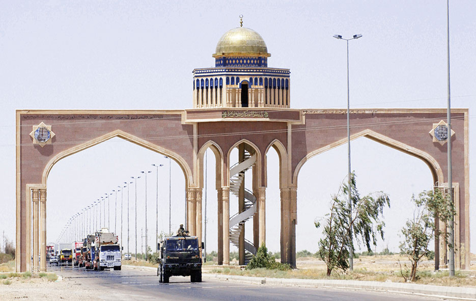 Gun truck from 2632nd Air Expeditionary Force Transportation Company, 3rd Platoon, responsible for providing security to military and civilian convoys as they transport supplies to multiple Forward Operating Bases throughout Iraq, leads convoy on Main Supply Route, June 2004 (U.S. Air Force/Scott Reed)